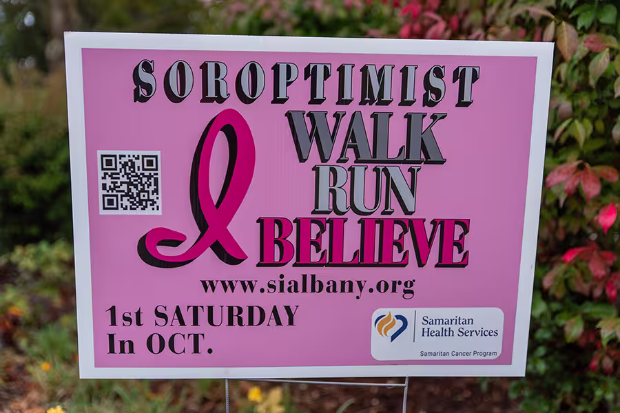 Signage from the 2024 Walk for the Cause, with the text Walk Run Believe, the web address of this website, and a reminder that it is the first Saturday in October